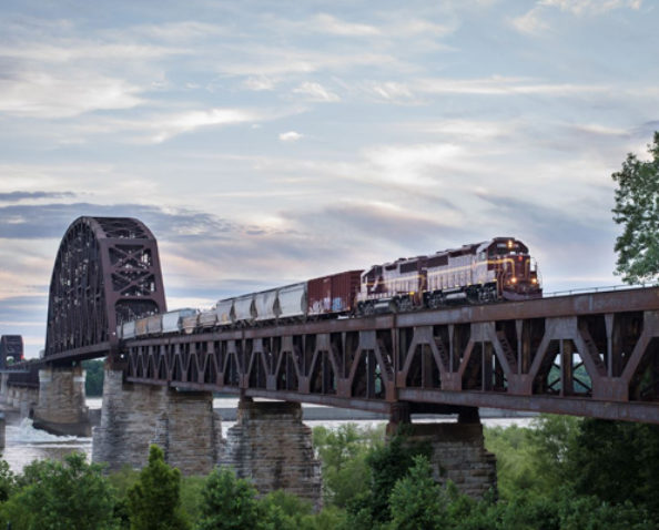 Louisville & Indiana Railroad train passing over a river on a bridge