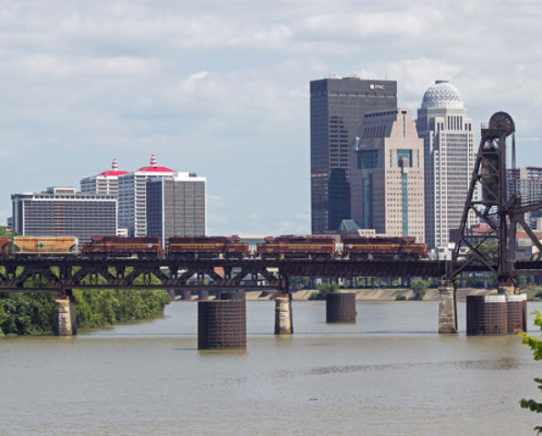 Louisville & Indiana Railroad train JXTR 1200 passing over a river on a bridge