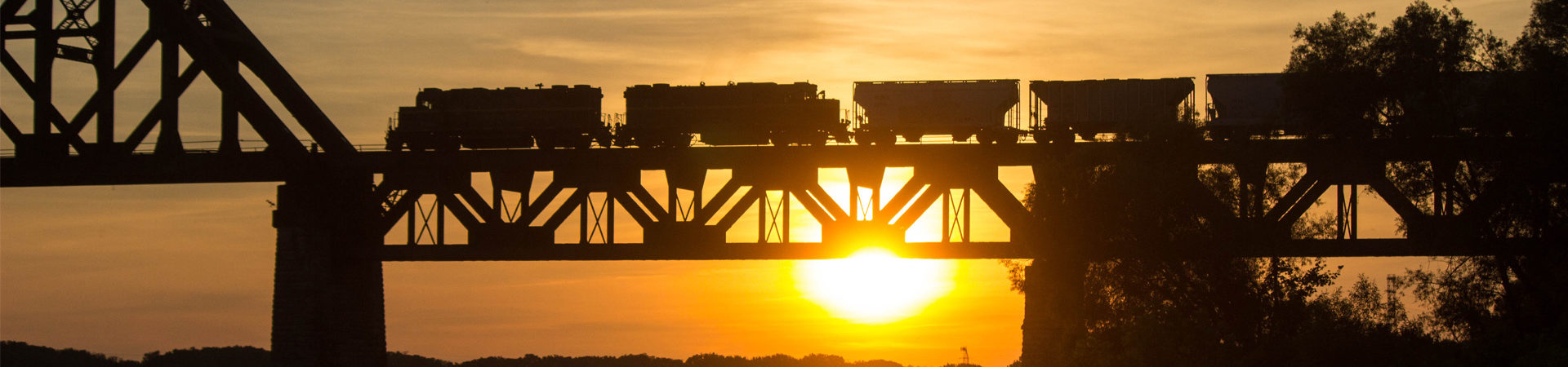 Image of LIRC train on a bridge during sunset